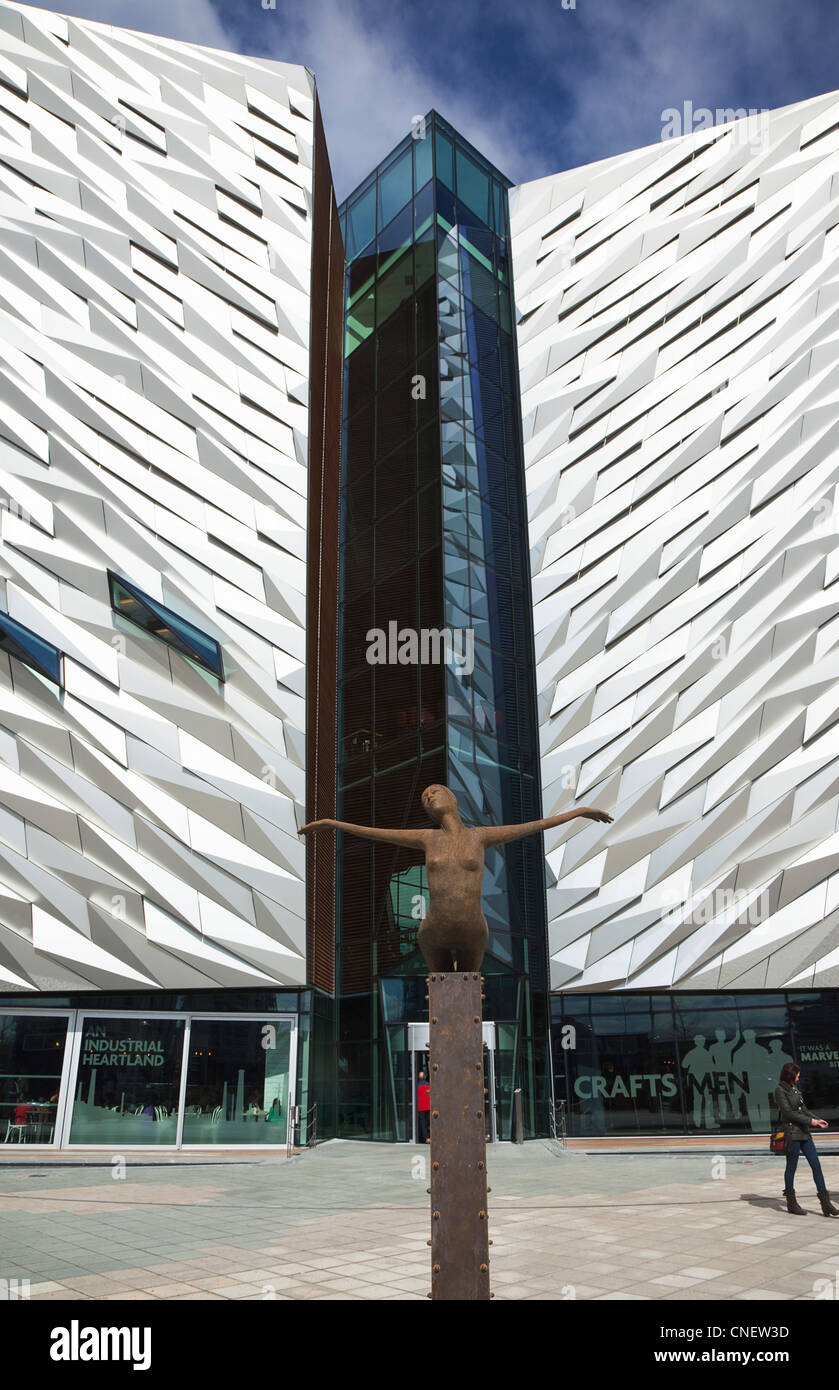 Ireland, North, Belfast, Titanic Quarter, Visitor centre designed by Civic Arts & Eric R Kuhne, with statue of diving woman. Stock Photo