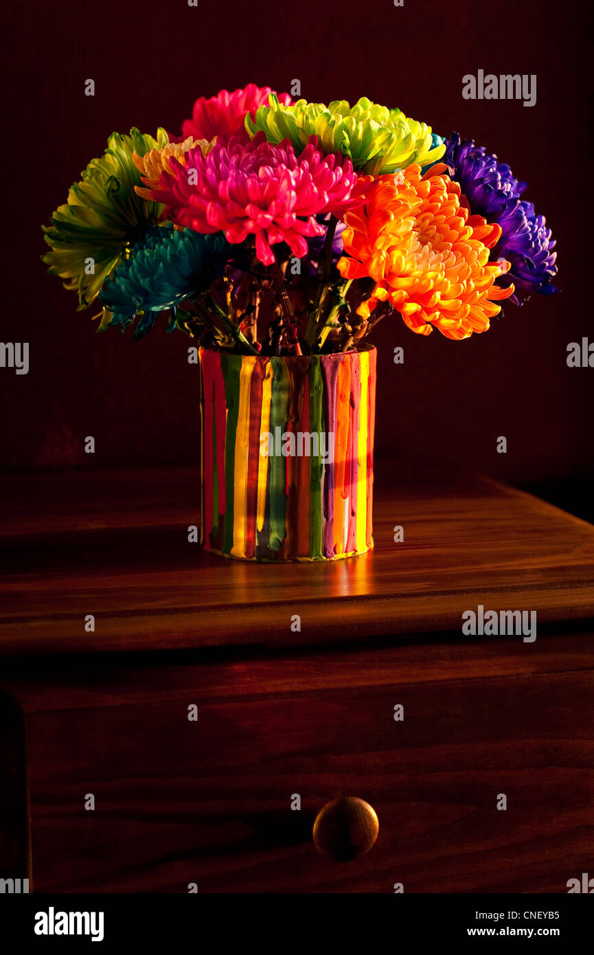 Multicolored Chrysanthemums In Paint Can On Chest Of Drawers