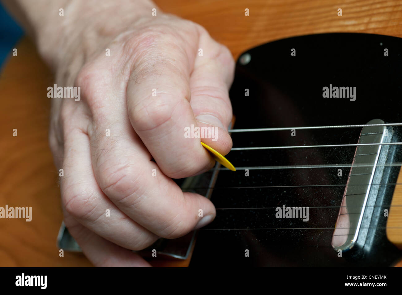 Hands playing a telecaster electric guitar Stock Photo