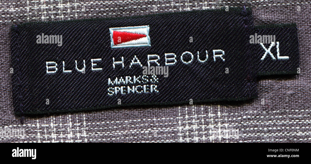 Detail of the label in the collar of a man's shirt from the clothing Blue harbor; Stock Photo