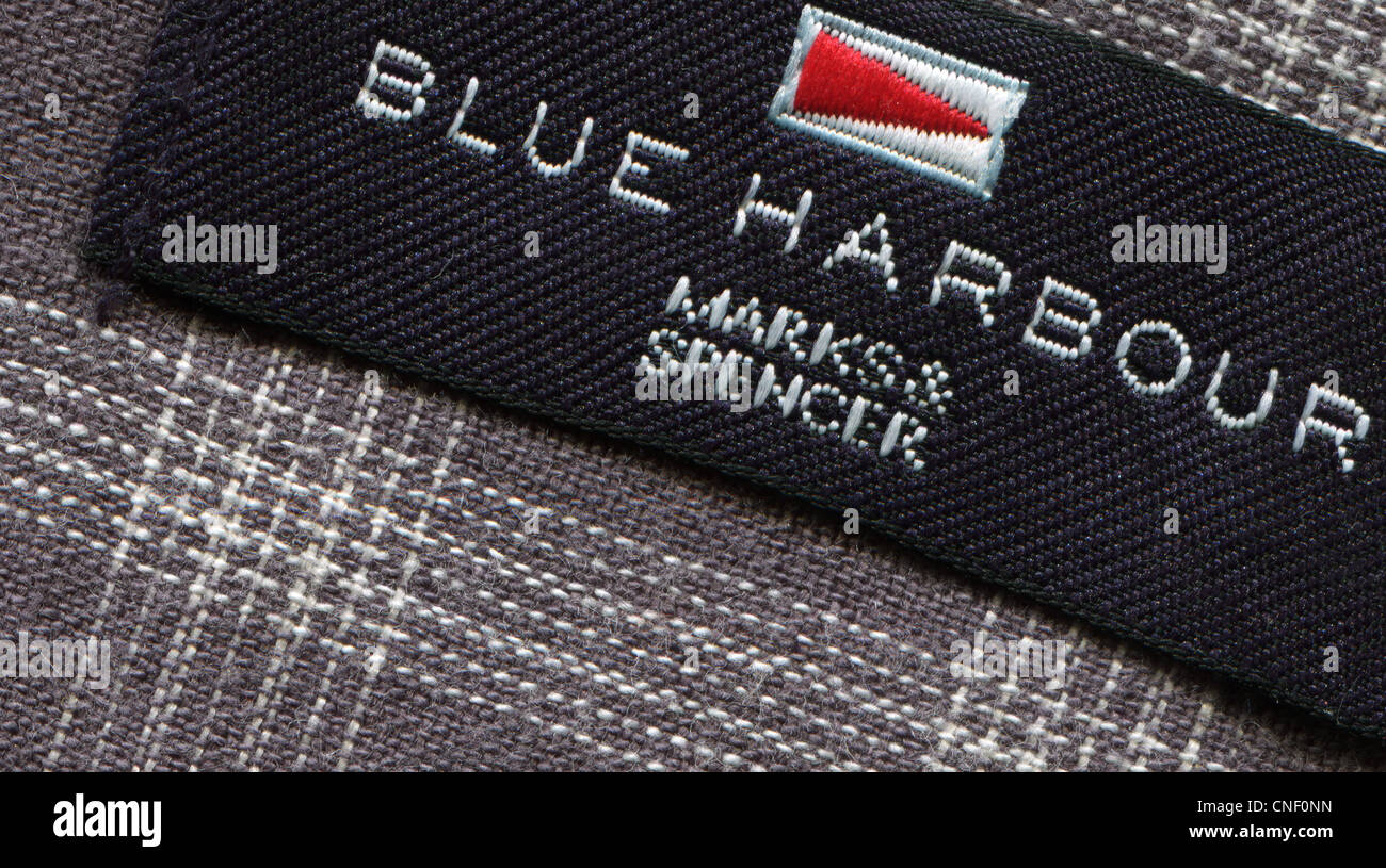 Detail of the label in the collar of a man's shirt from the clothing Blue Harbor Stock Photo