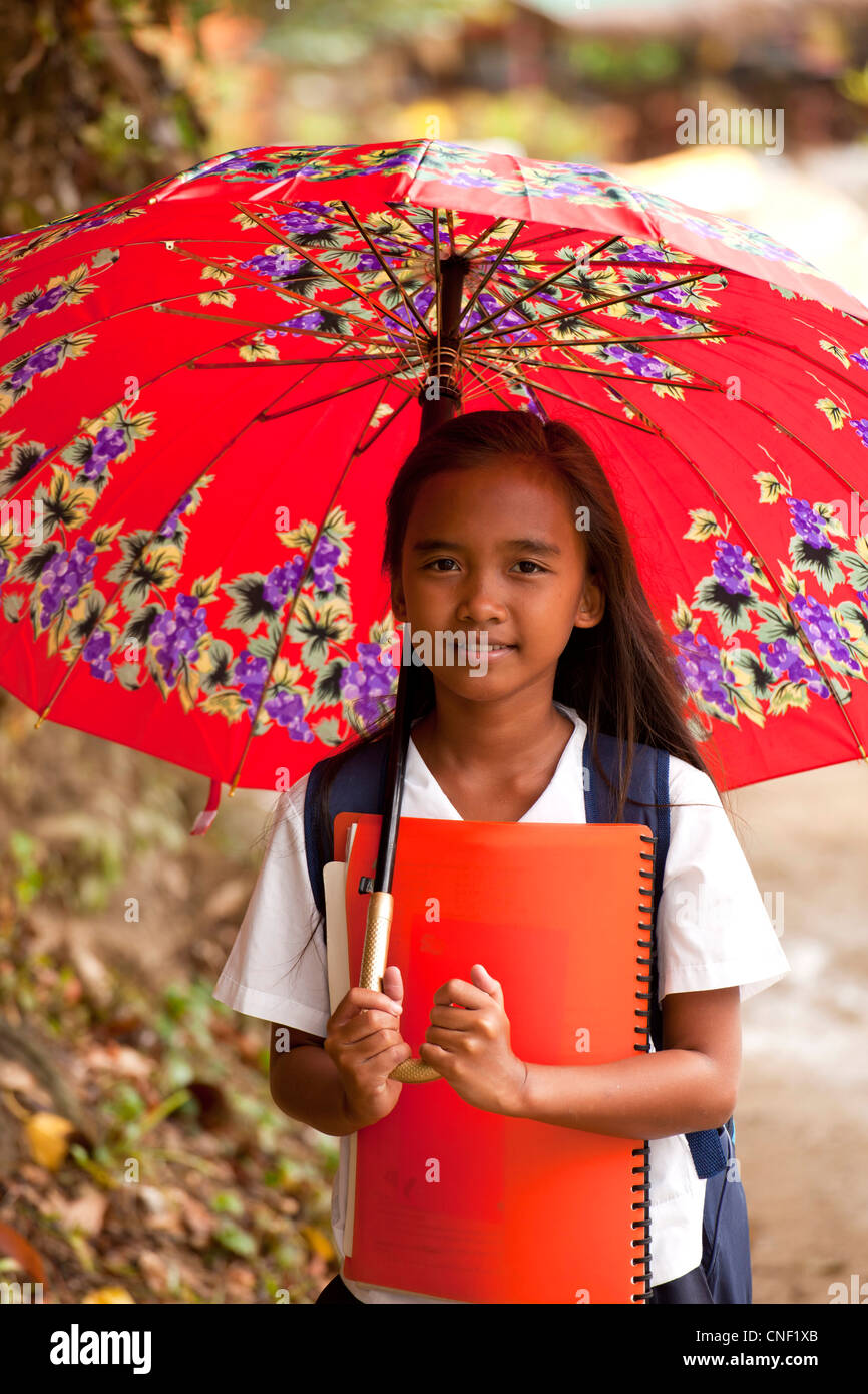 school girl with umbrella, El Nido, Palawan, Philippines, Asia Stock Photo