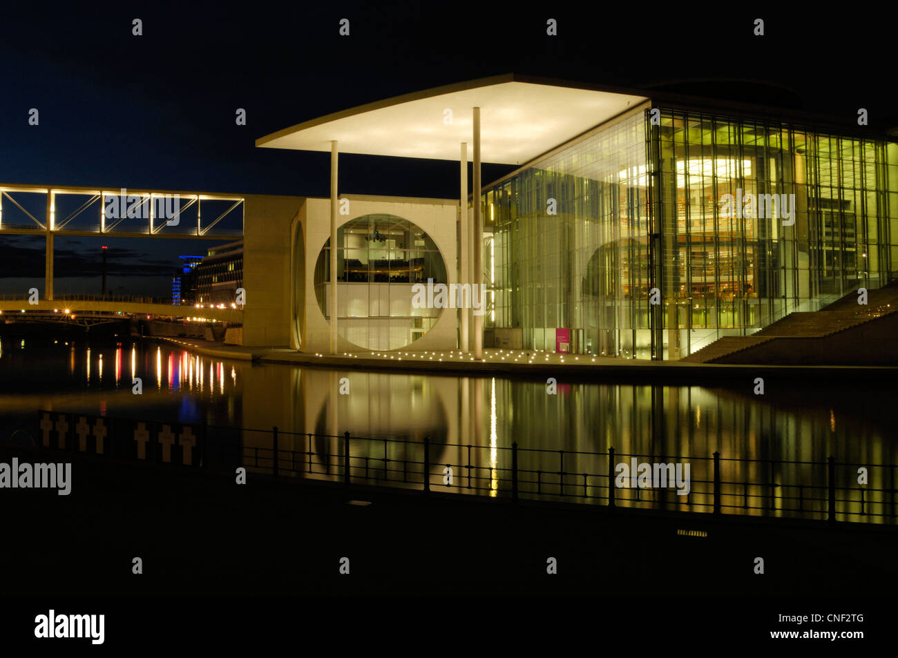 Parliamentary Library of the German Bundestag in the Spreebogen Berlin, known as 'The washing machine building' at night Stock Photo