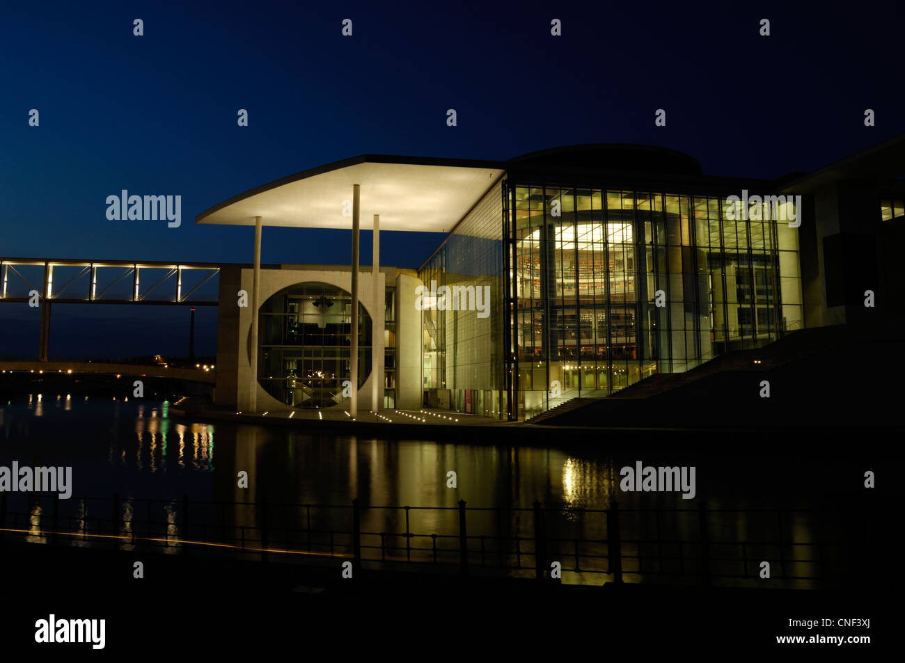 Parliamentary Library of the German Bundestag in the Spreebogen Berlin, known as 'The washing machine building' at night Stock Photo
