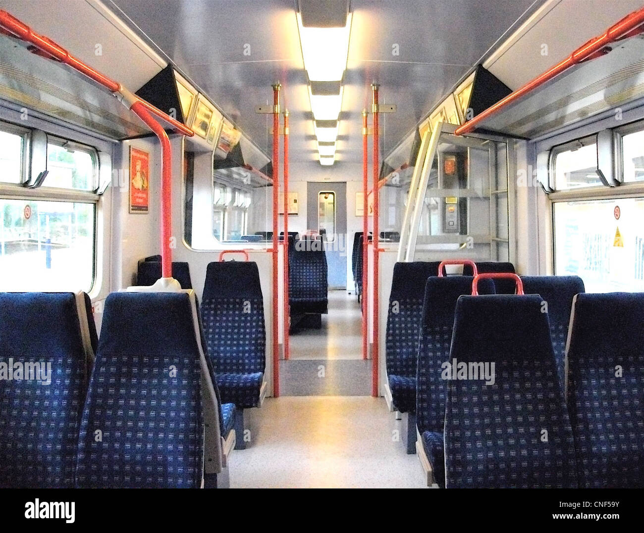 Half internal view of Standard Class accommodation aboard a refreshed First Capital Connect Class 319/4 EMU. Stock Photo
