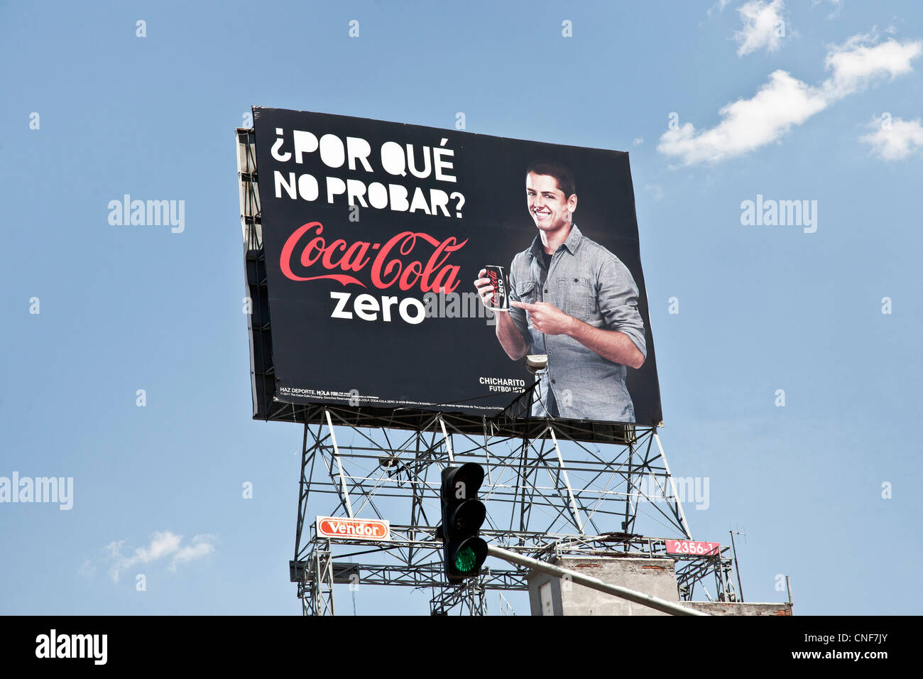 large billboard showing Mexican soccer star Javier Chicharito Hernandez endorsing Coca Cola Zero above intersection Mexico City Stock Photo