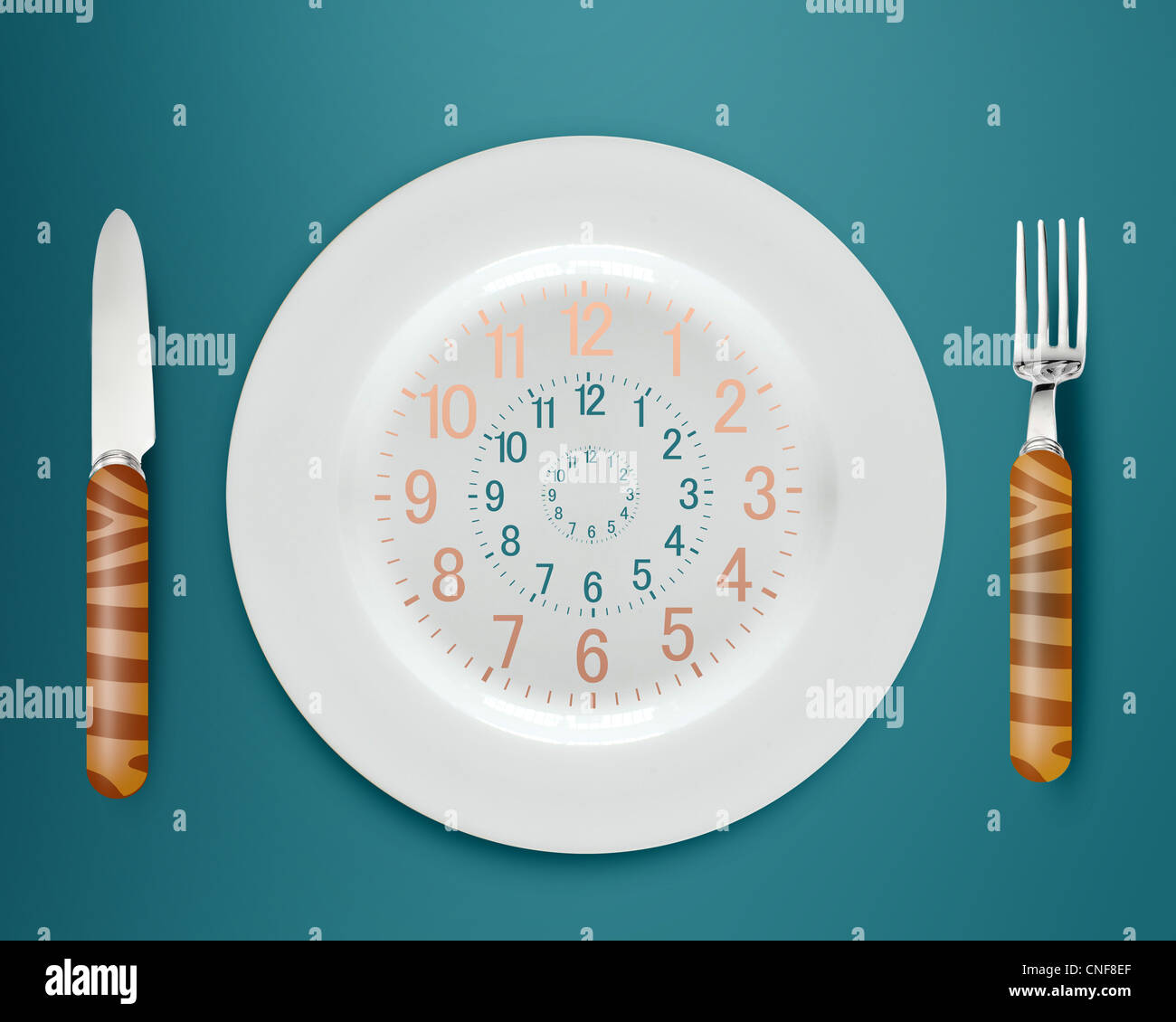Lunch time concept, clock in plate, knife and fork Stock Photo - Alamy