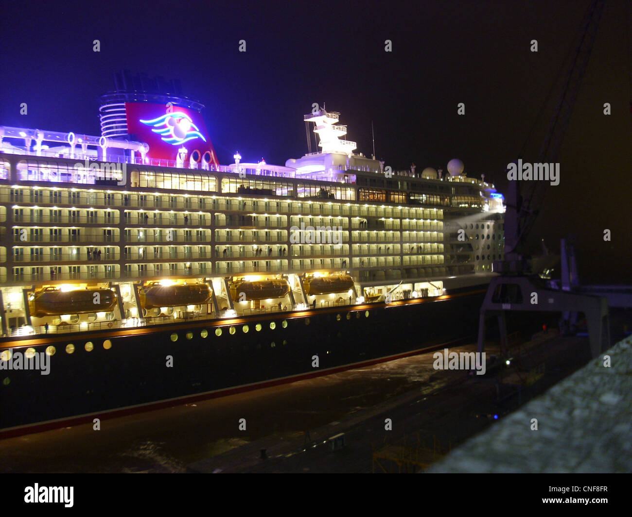 The cruise ship Disney Fantasy is leaving Bremerhaven for a see trial journey Stock Photo