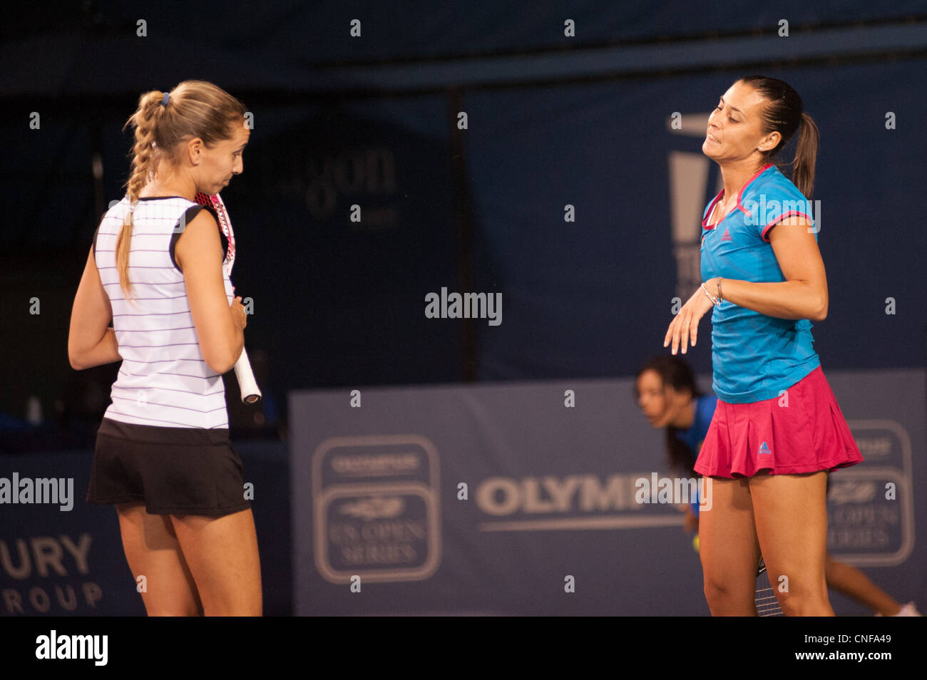 Doubles partners, Flavia Pennetta and Gisela Dulko, on tennis court at La Costa Resort in Carlsbad, California. Stock Photo