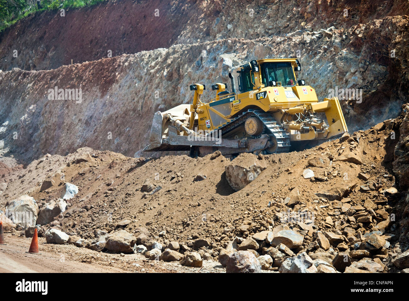 Bulldozer widening the highway, El Salvador Stock Photo