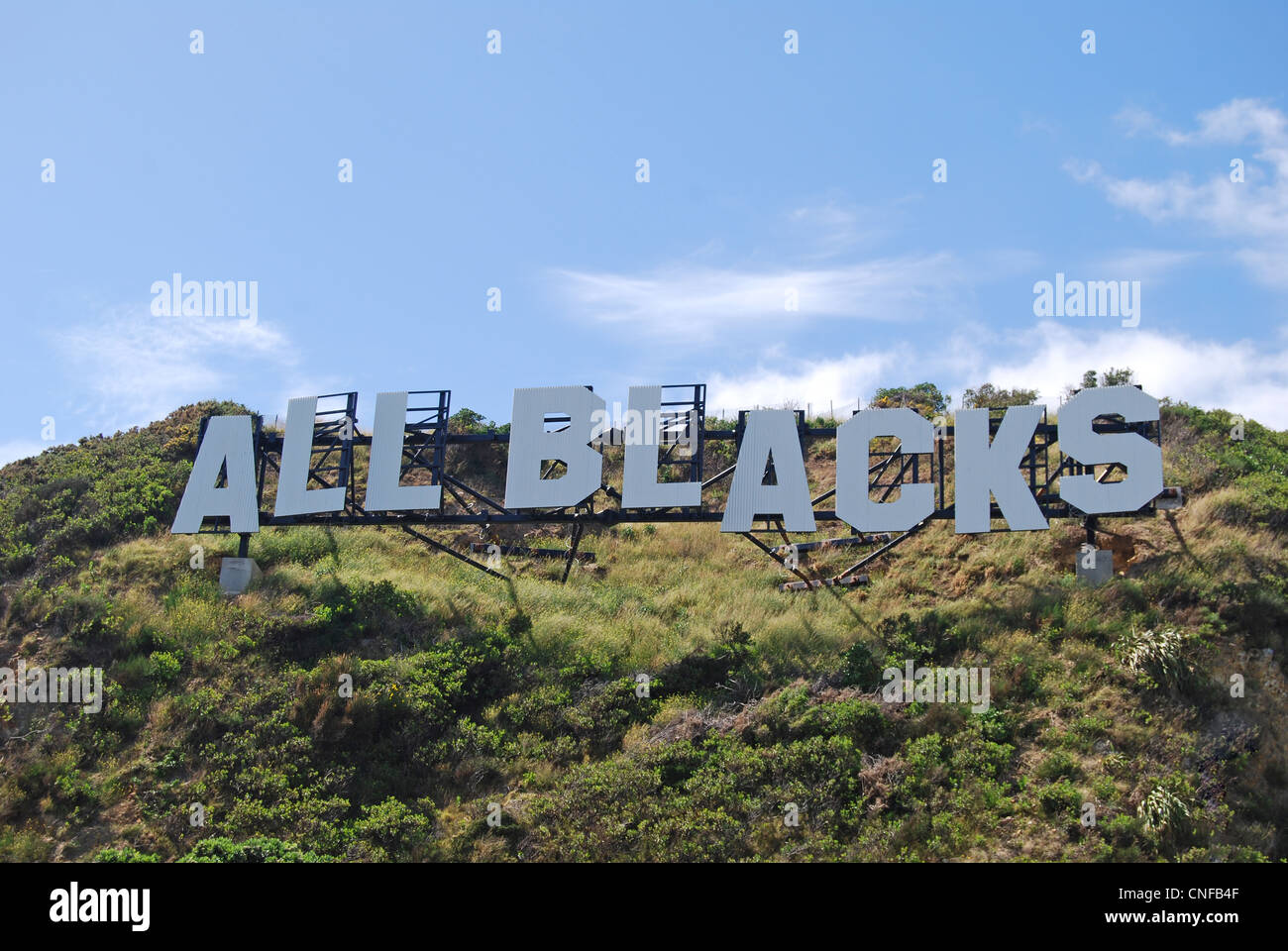 Giant All Blacks sign on hillside, Miramar Peninsula, Wellington, Wellington Region, North Island, New Zealand Stock Photo