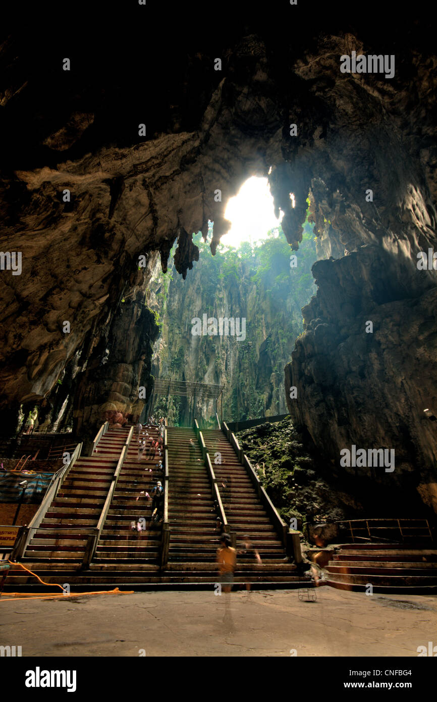 Inside the huge limestone grotto at the Batu Caves Stock Photo