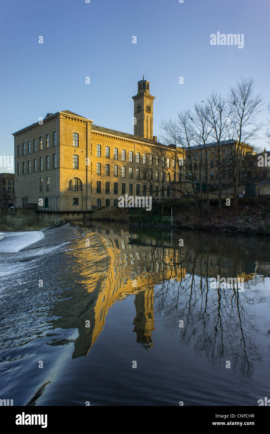Salt's Mill reflected in the River Aire Saltaire West Yorkshire England Stock Photo