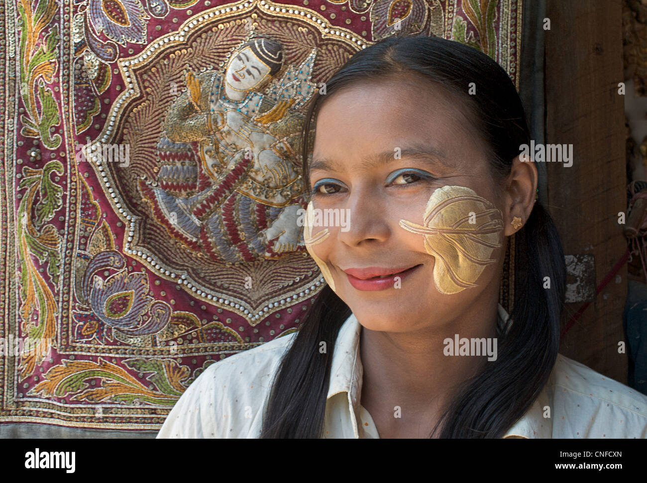 Burmese woman Mandalay, with thanaka painted face - distinctly Burmese Stock Photo