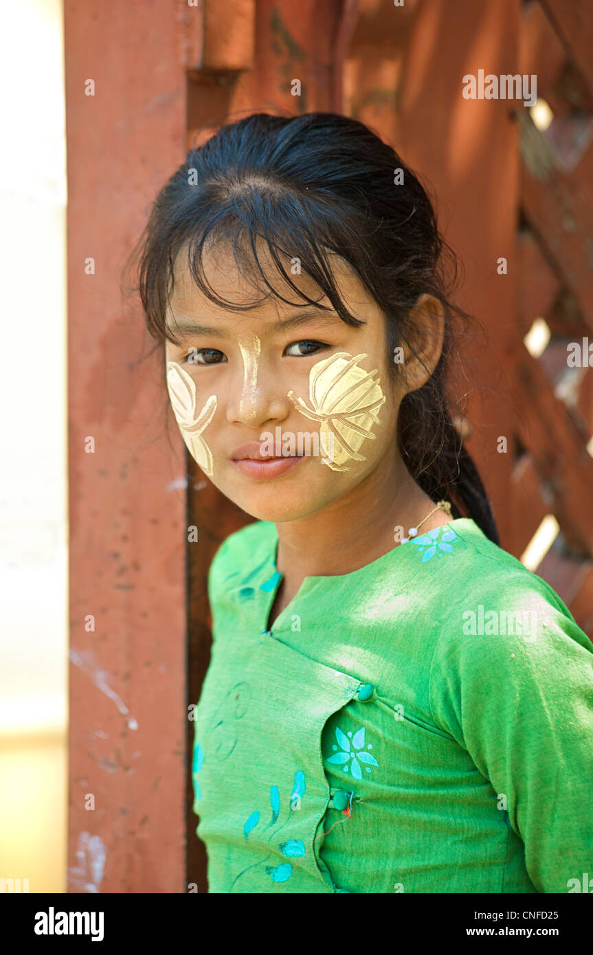 Portrait of a Burmese girl with distinctly Burmese face decoration, Mandalay, Burma. Myanmar Stock Photo