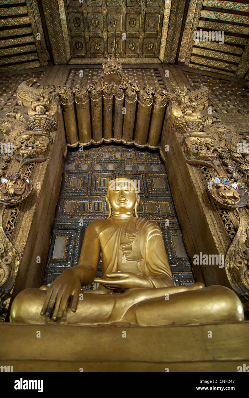 Buddha statue at Shwenandaw Kyaung in Mandalay, Burma. Teak monastery. Myanmar Stock Photo