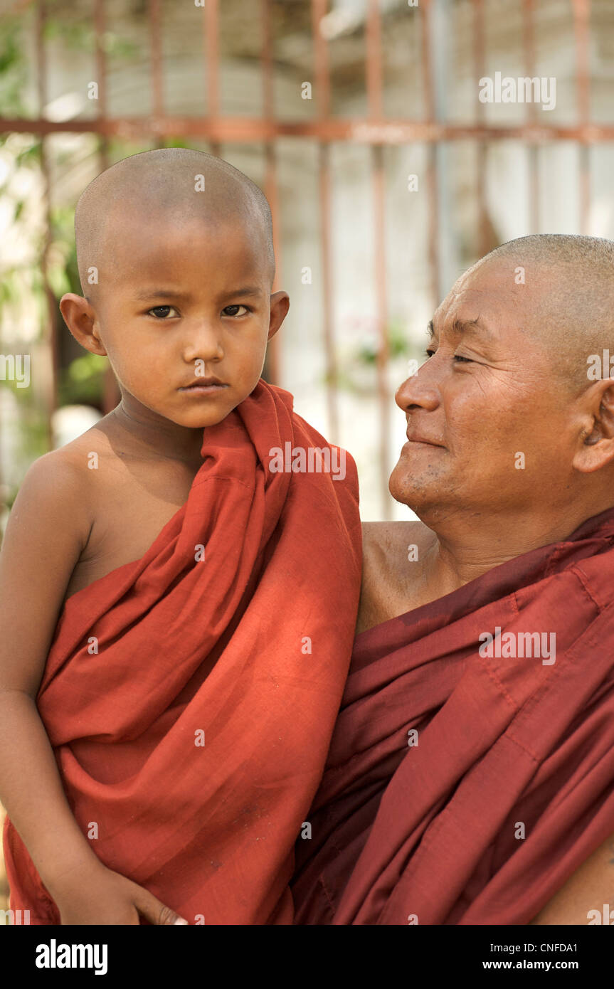 Monk and novice at Atum Ash Kyaung or  Atumashi Monastery, Mandalay, Burma. Myanmar Stock Photo