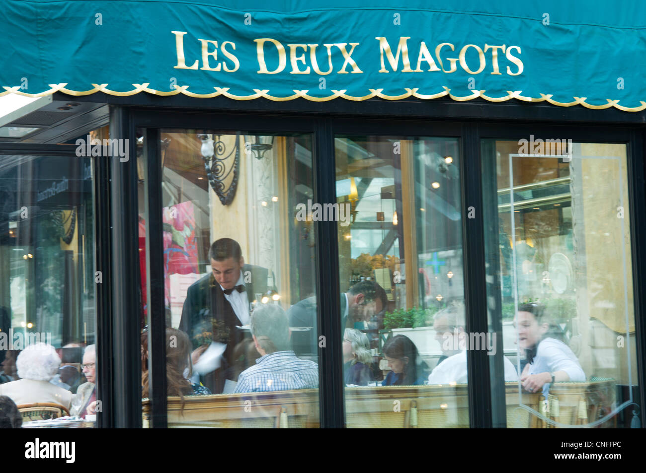 People eating at cafe Les Deux Magots on Boulevard Saint Germain in Paris, France Stock Photo