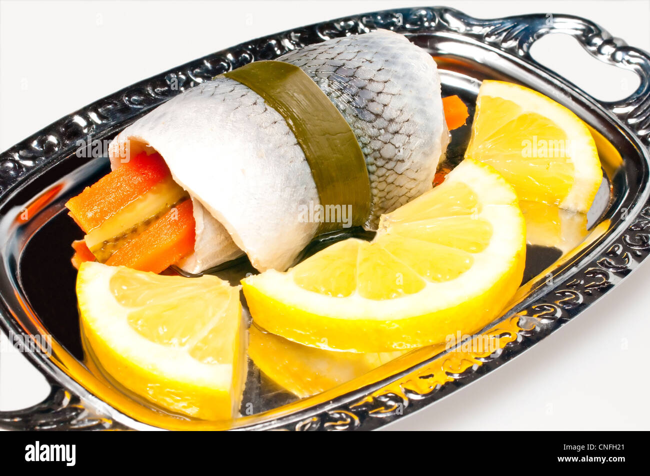 pickled herring with lemon slice Stock Photo Alamy