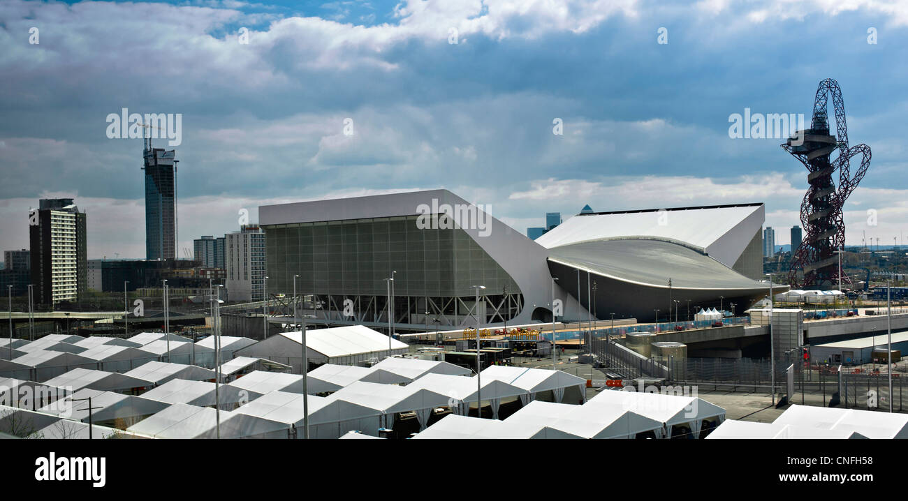 LONDON, UK - APRIL 15, 2012:  London Olympic Park Under Construction in April 2012.  Aquatic Centre on Left and Orbit Observation Tower on right. Stock Photo