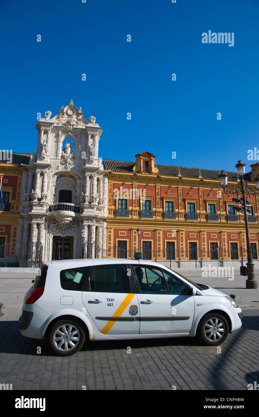 Taxi cab in front of Palacio de San Telmo along avenida de Roma street central Seville Andalusia Spain Stock Photo