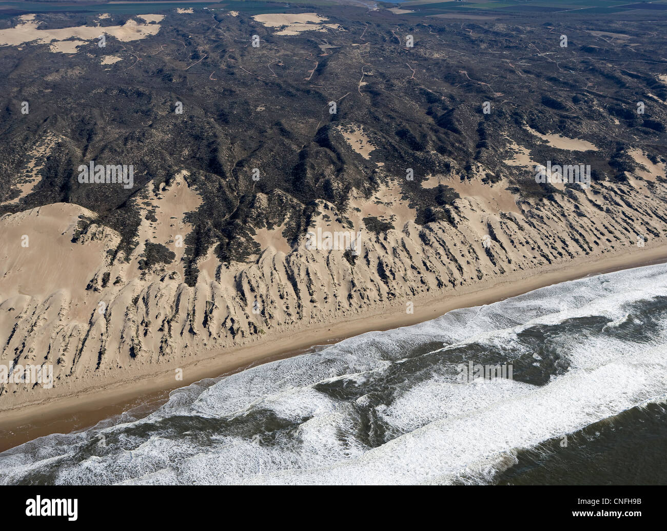 aerial photograph remote sand dunes Pacific Ocean central California coast Stock Photo