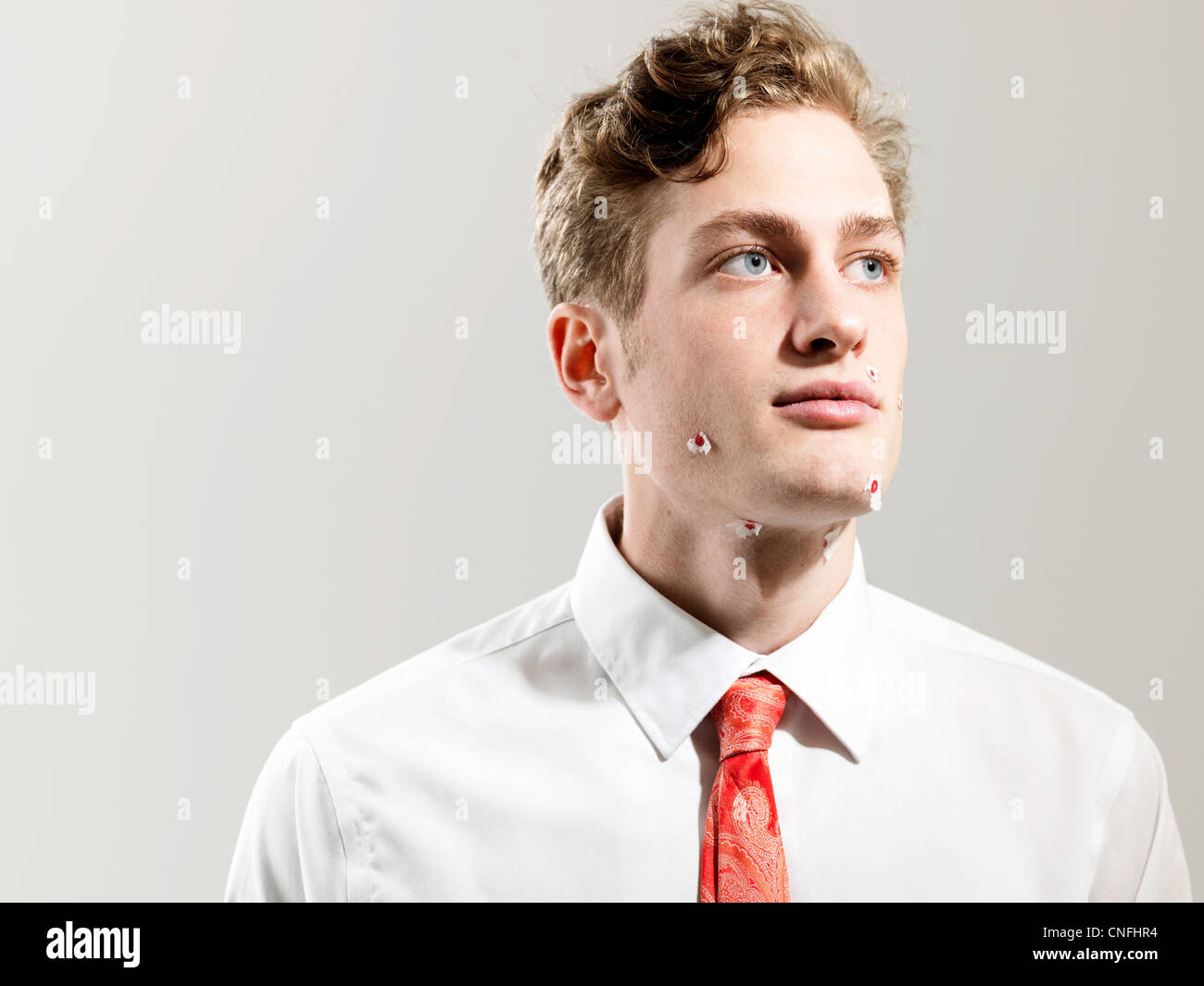 Young man with shaving marks, studio shot Stock Photo