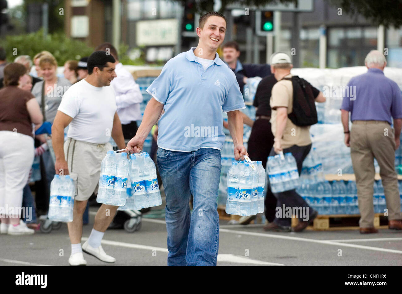 Flood victims residents of Gloucester collect emergency supplies of