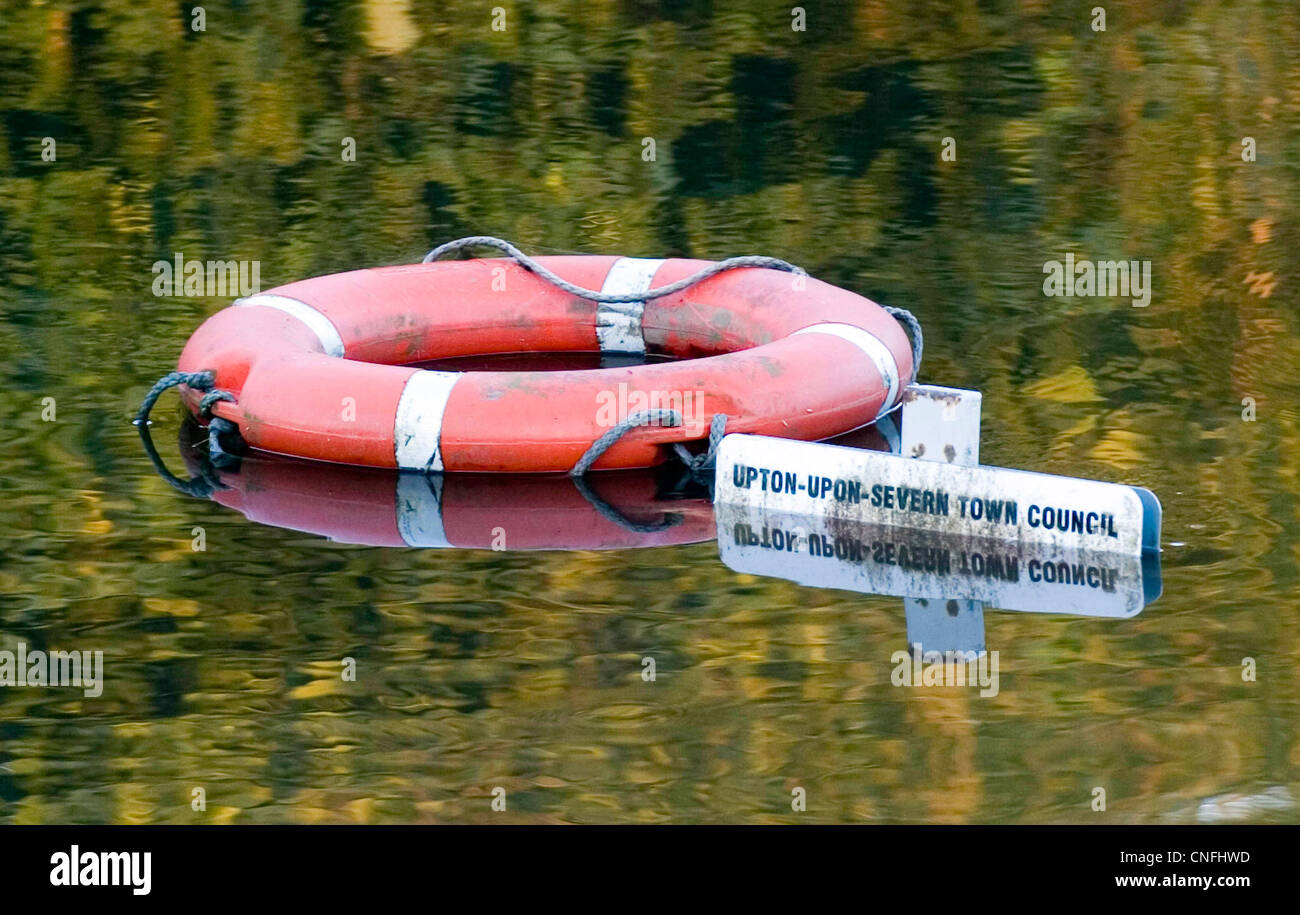 Upton Upon Severn town council sign underwater alongside a lifebouy