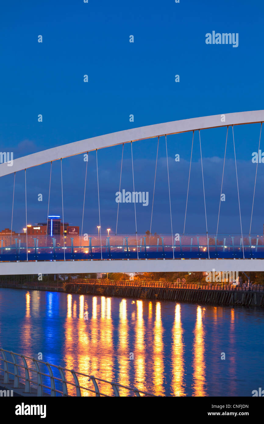 Light reflections on the canal of Salford quays with the Lowry bridge