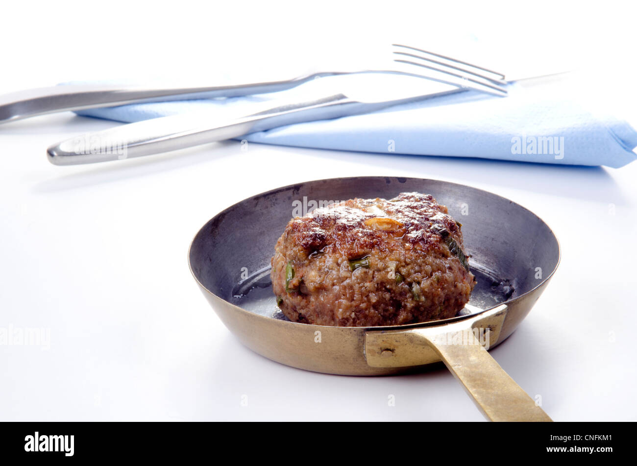 freshly fried meat ball in a brass pan Stock Photo
