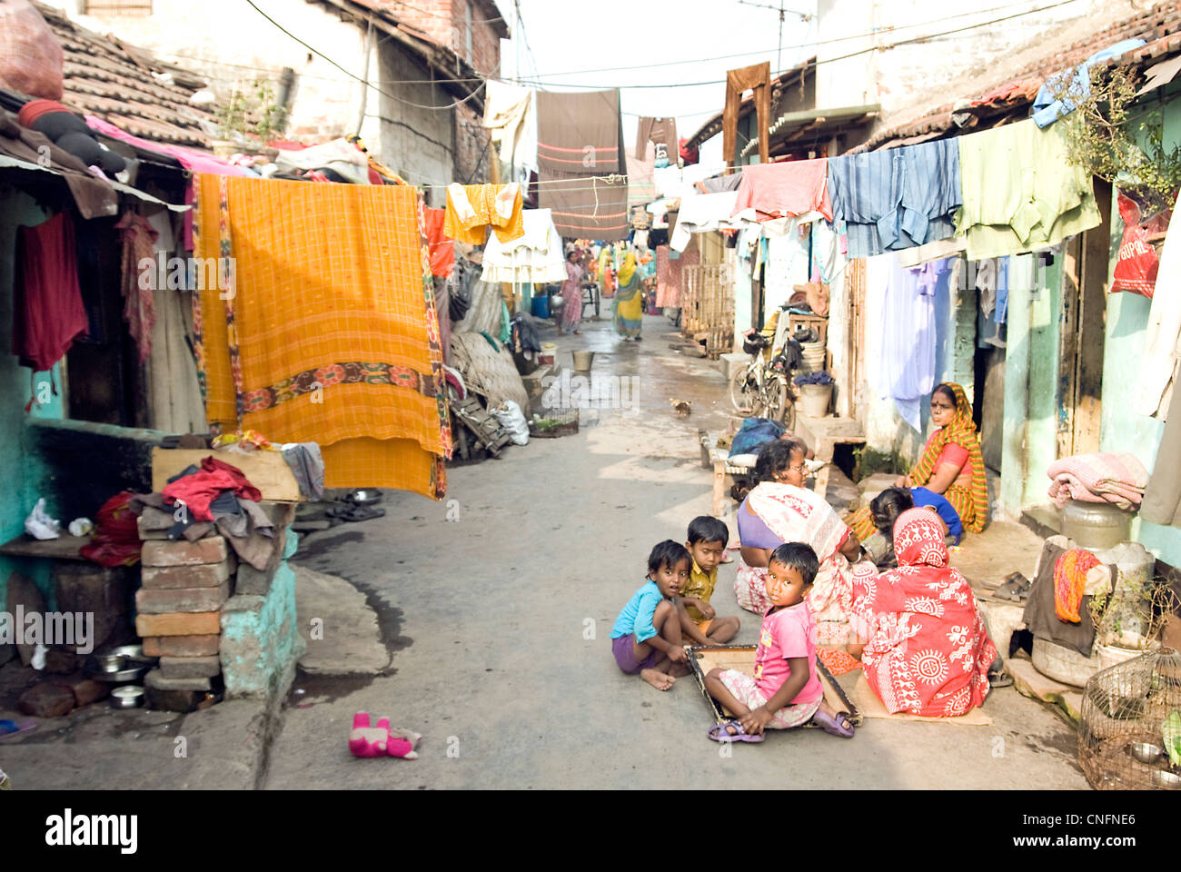 People on the street in  the shanty town inside  Kolkata city Stock Photo