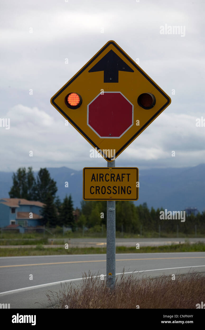 aircraft crossing sign flashing lights Lake Hood airport Anchorage Alaska Stock Photo