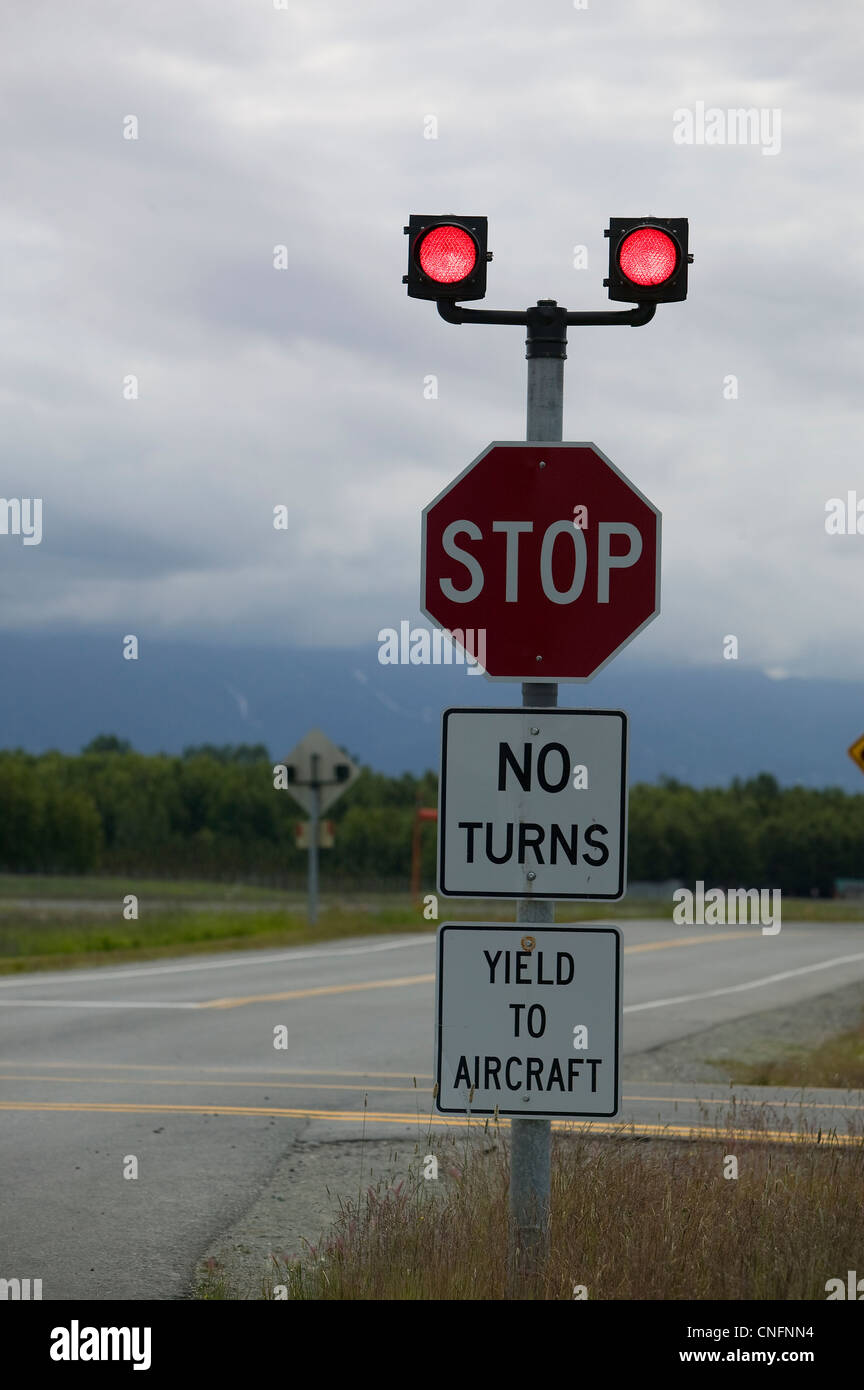yield to aircraft sign stop aircraft crossing Lake Hood airport Anchorage Alaska Stock Photo