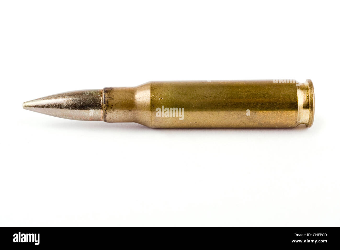 Single rifle bullet over white Stock Photo