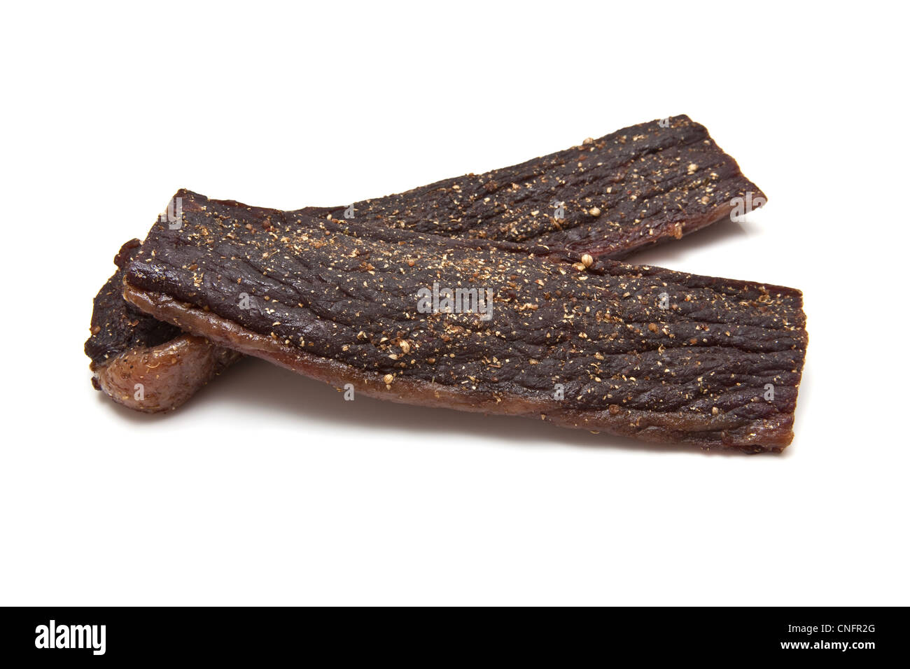 South African biltong (beef jerky) isolated on a white background Stock ...