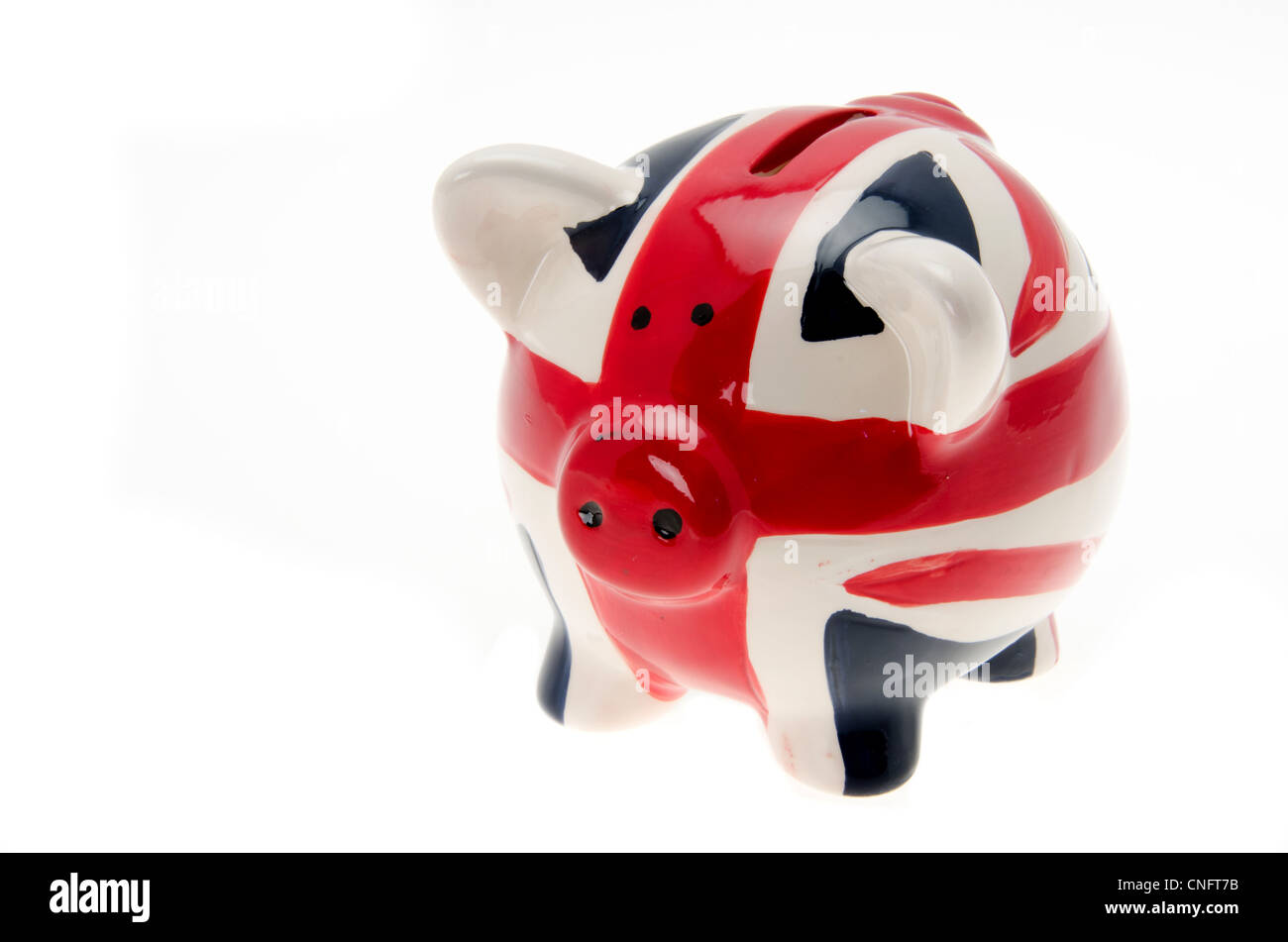 Piggy bank money box painted with a UK flag design 'Union Jack' - isolated against a white background Stock Photo