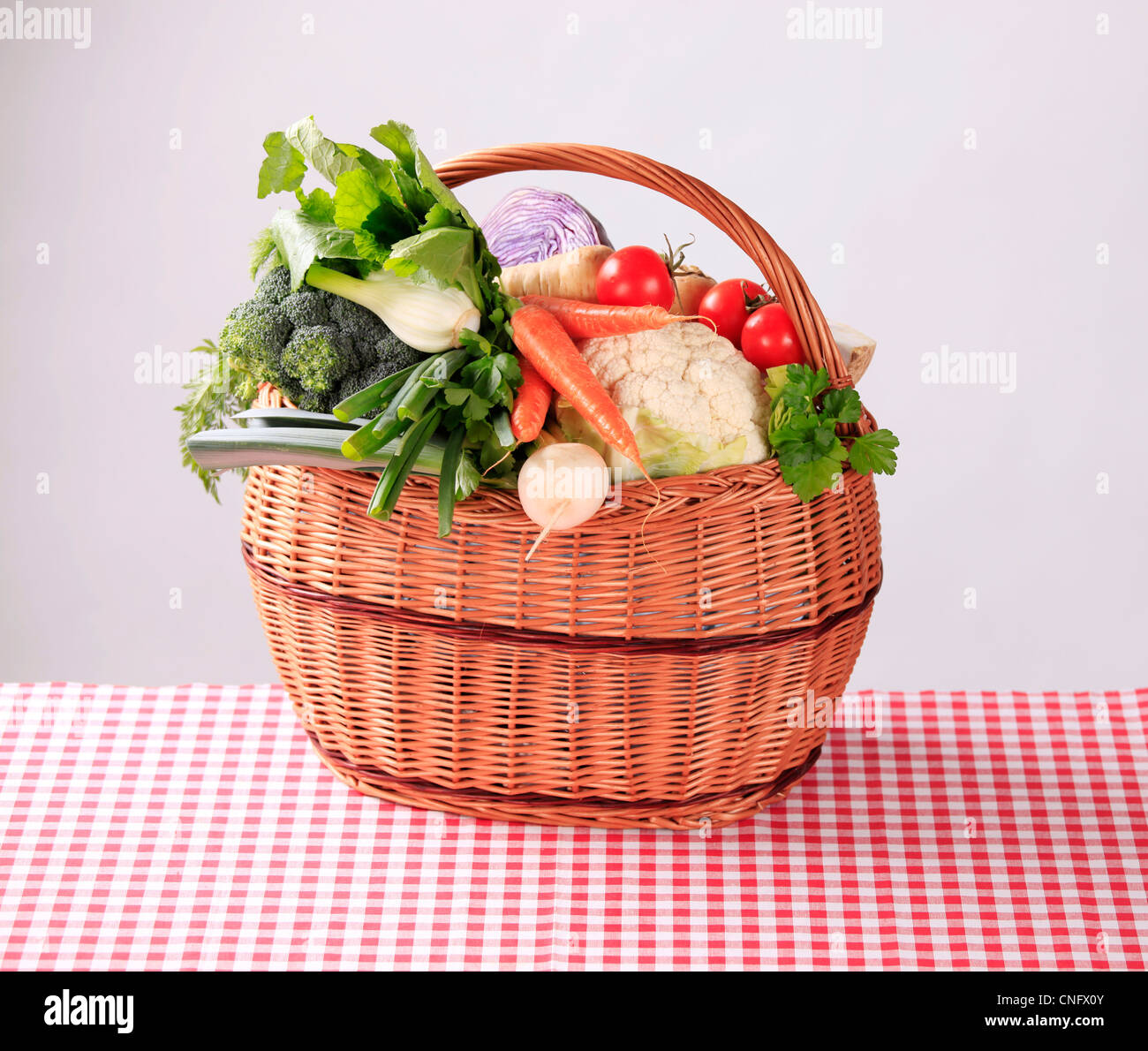 Variety of fresh vegetables in a wicker basket Stock Photo - Alamy