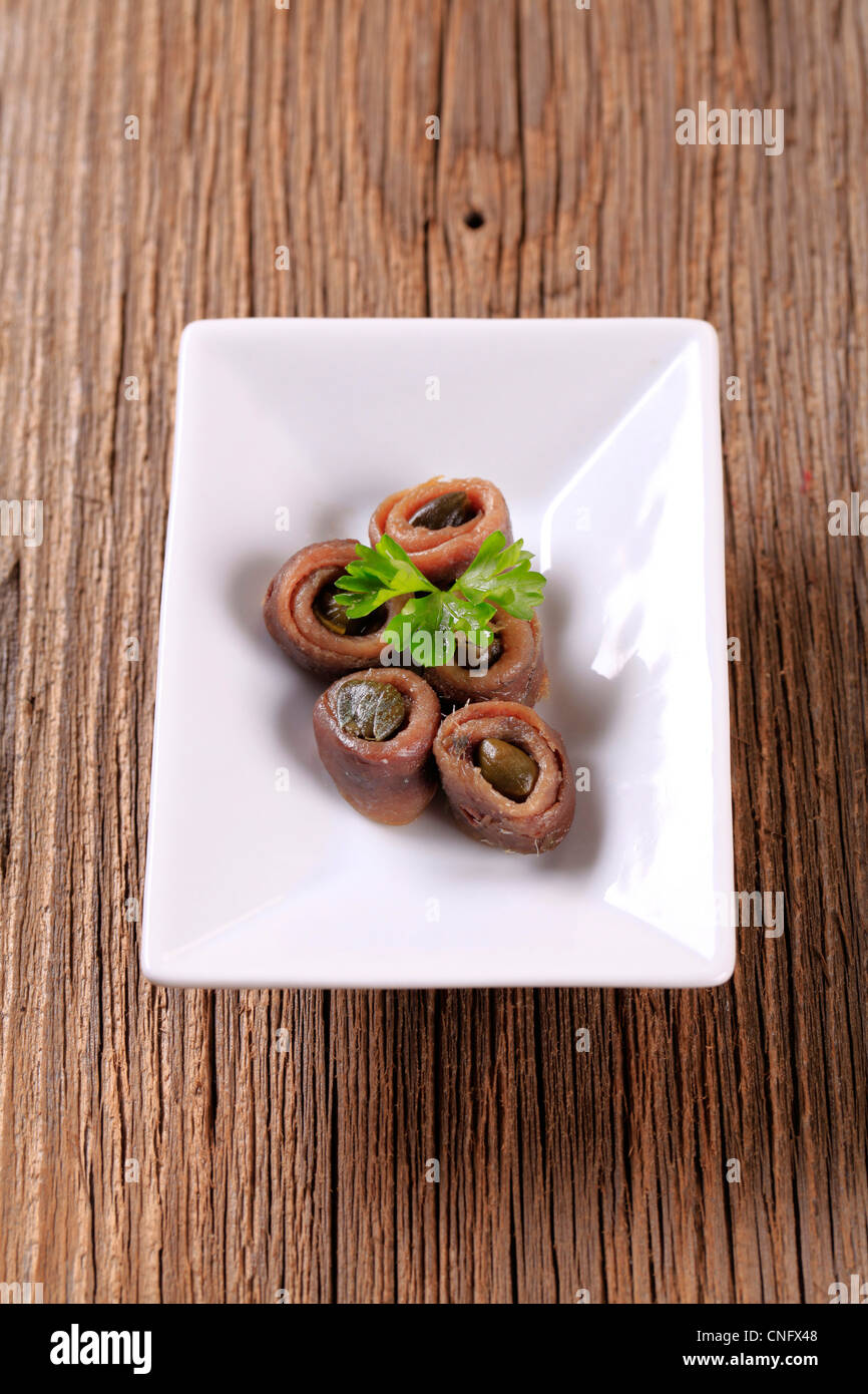 Rolled up anchovy fillets filled with capers Stock Photo Alamy