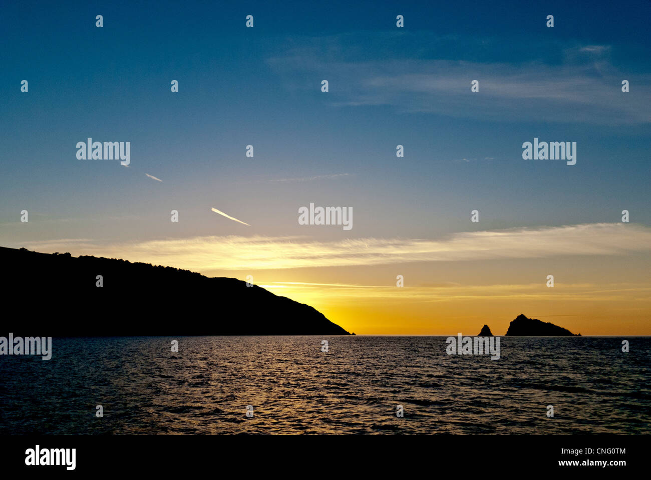 Entrance to River Dart at dawn showing off lying rocks Stock Photo