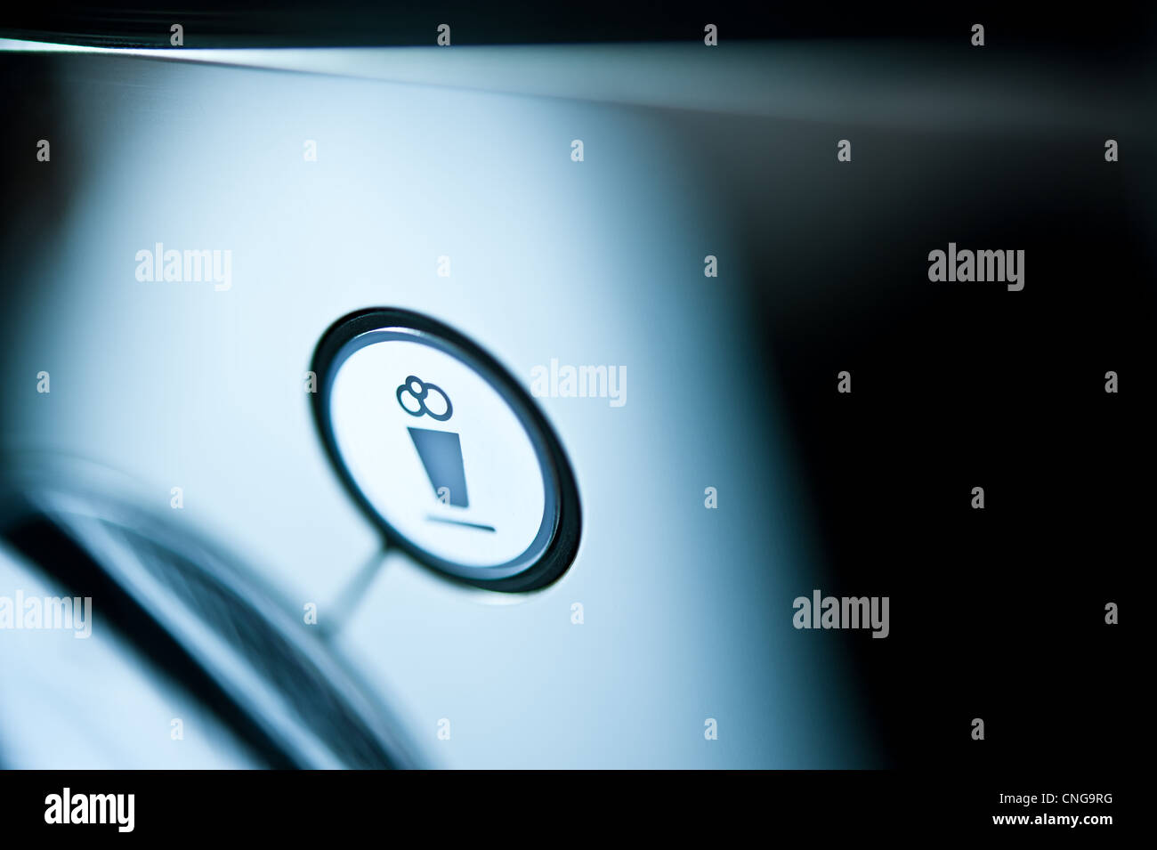 Close detail of an espresso machine, button, symbol Stock Photo Alamy