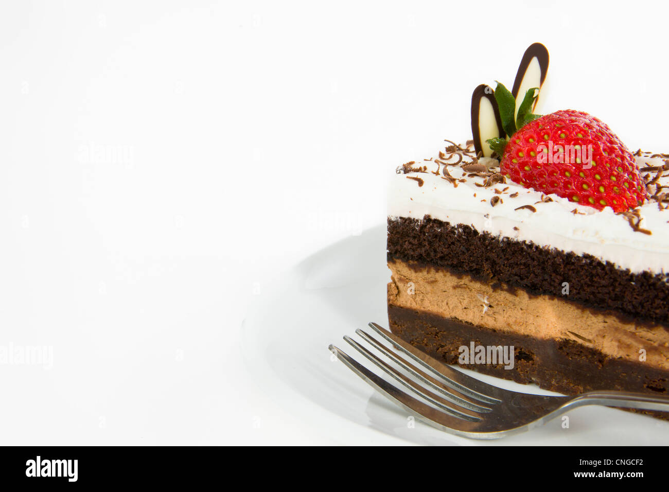 Piece of chocolate cake with strawberry decorate on top Stock Photo - Alamy