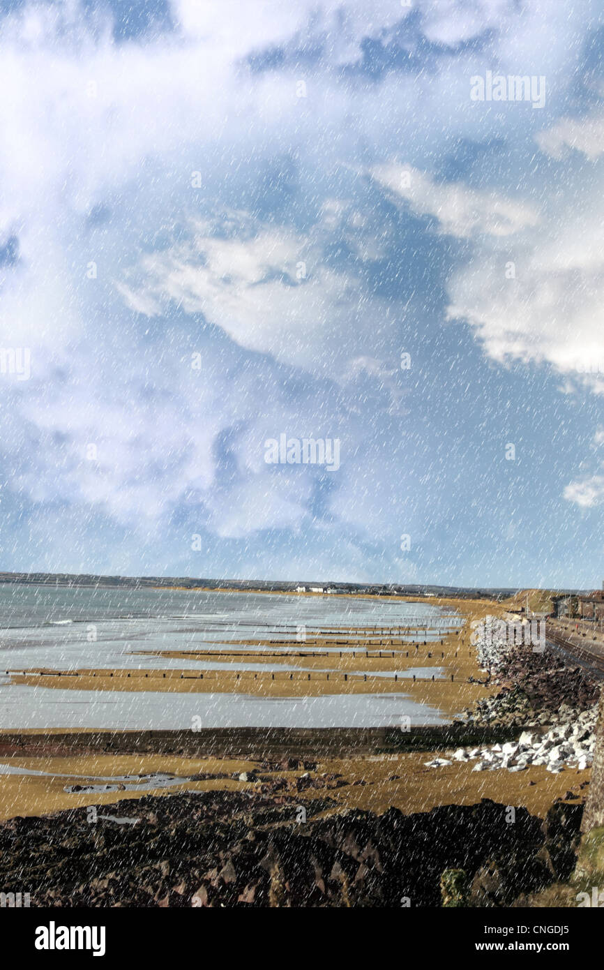 beach during a rain storm on the rocks in youghal county cork ireland
