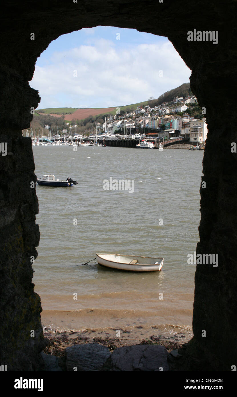 Boat on river seen through hole in wall Stock Photo Alamy
