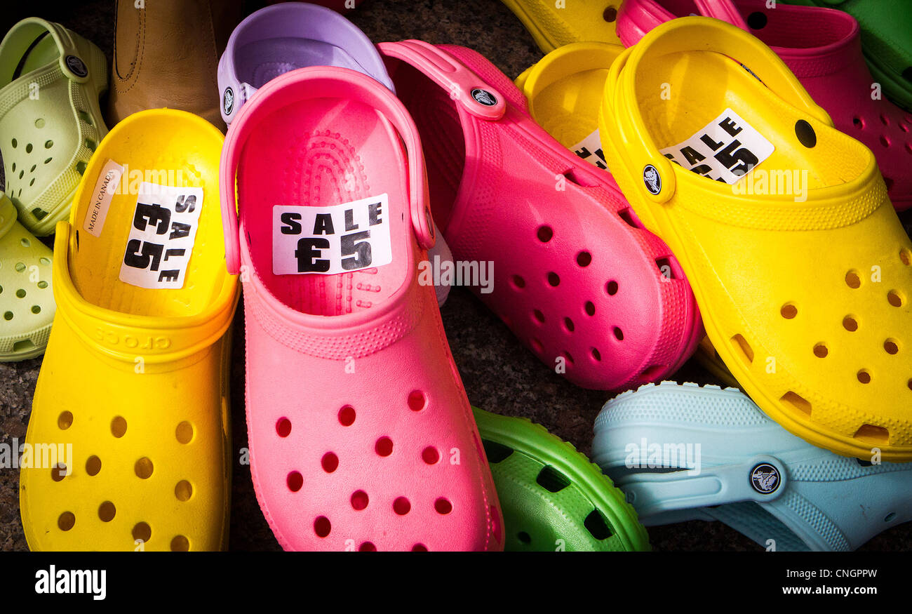 A collection of colourful 'Crocs' for sale outside a shoe shop in ...