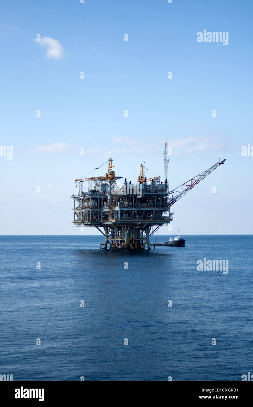 Oil production platform and standby vessel, Gulf of Mexico Stock Photo