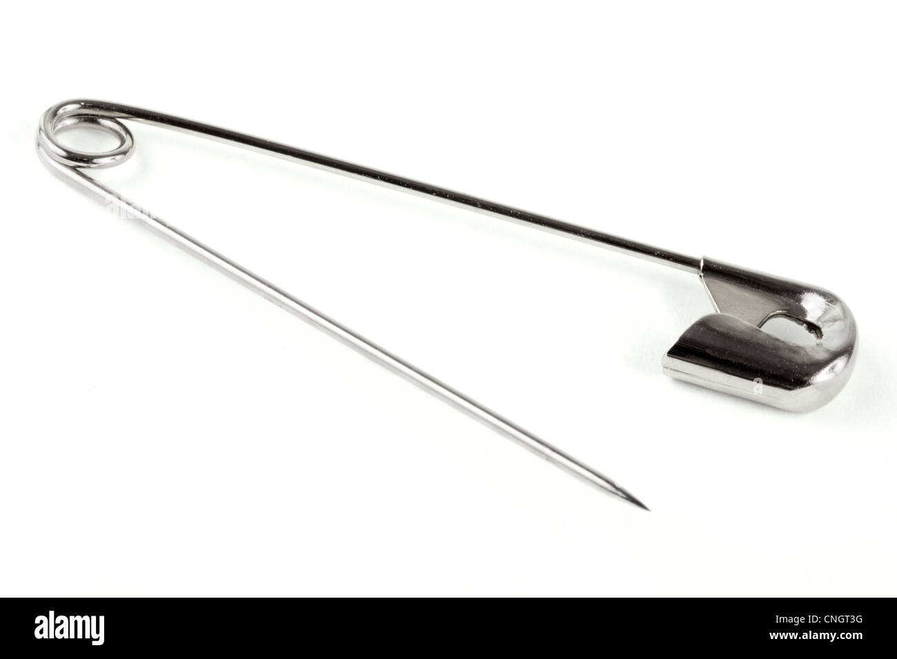 Open safety pin on a white background Stock Photo Alamy