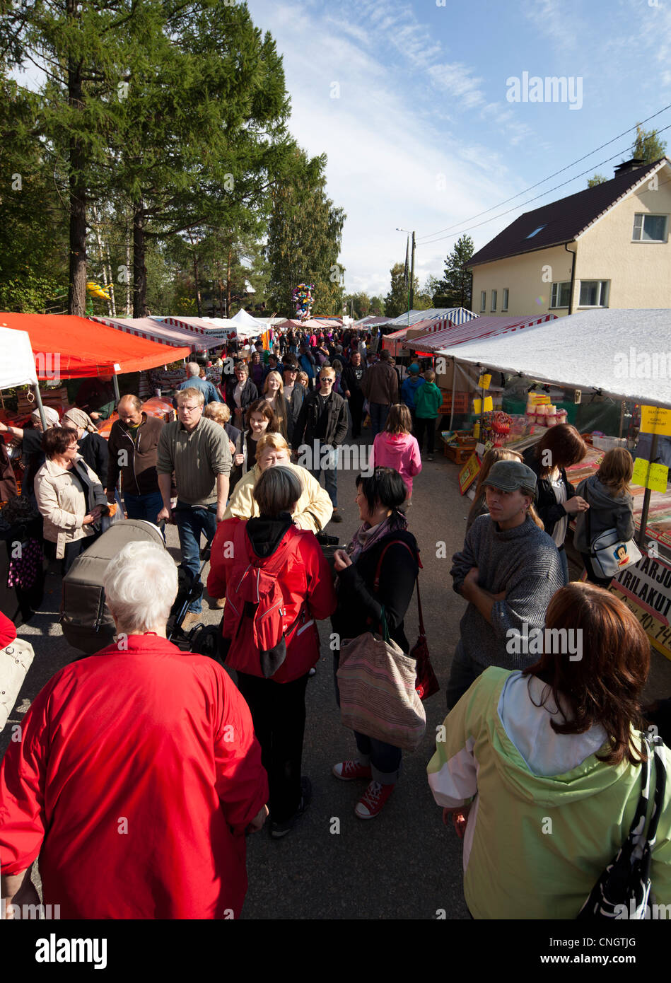 People at  Pestuumarkkinat street sales happening at Rautalampi Finland Stock Photo