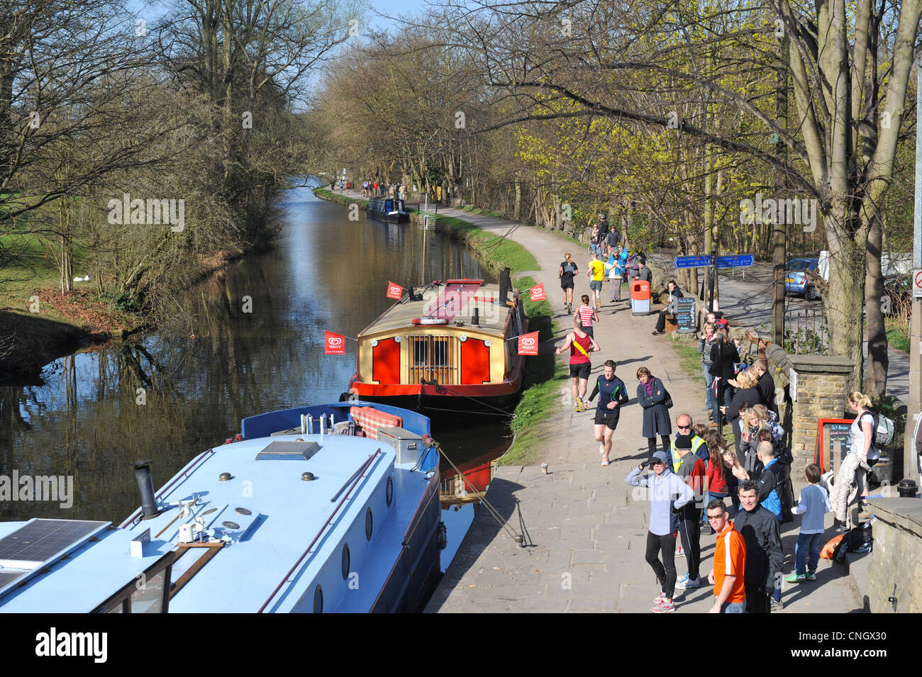 Running on theAire Valley Canal Towpath, Saltaire, Yorkshire Stock Photo
