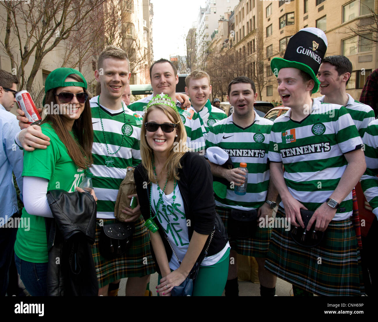Happy group at the Saint Patrick's Day Parade on 5th Ave. in NYC. Members of the Celtic Football Club and friends. Stock Photo
